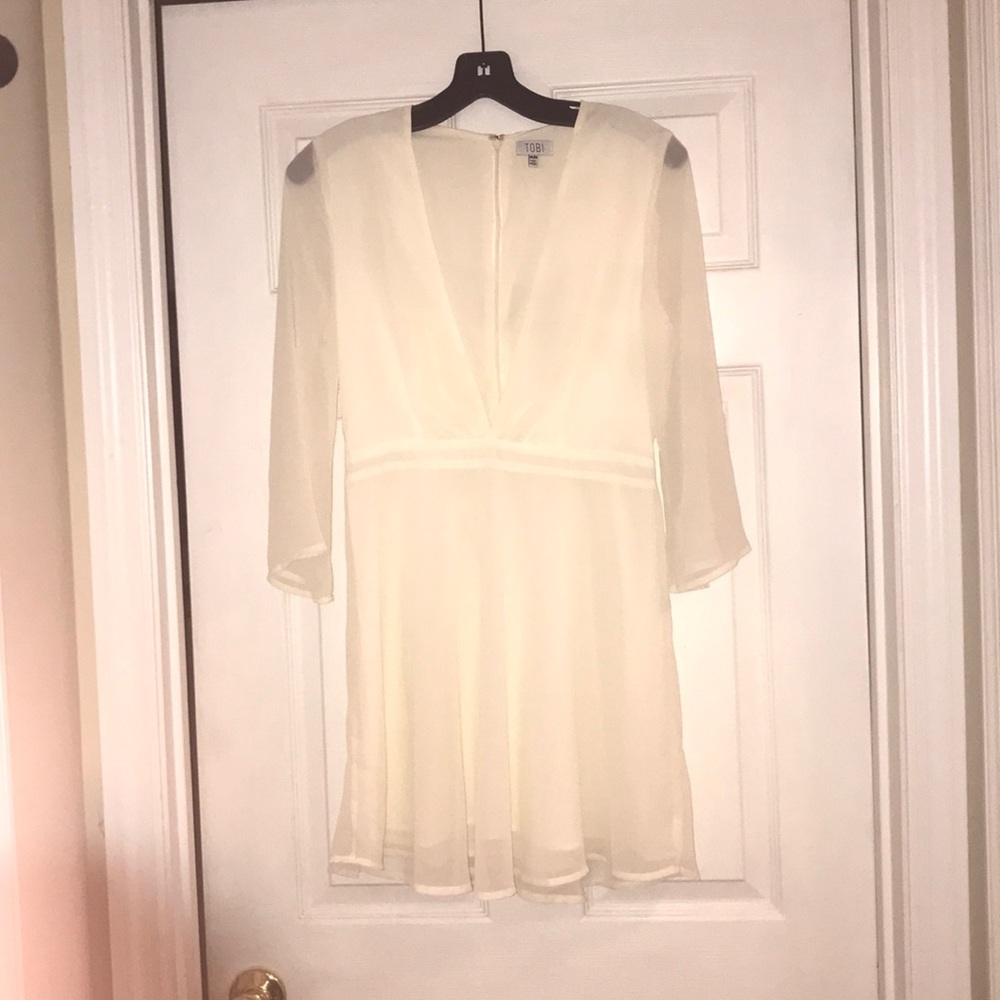 Plunging V neckline white dress